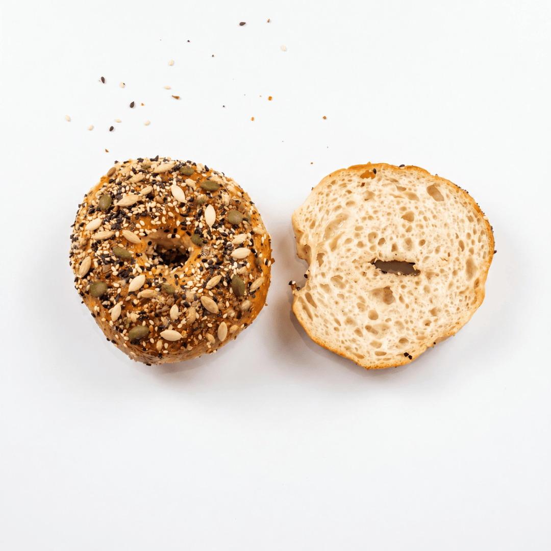 Overhead view of Gluten-Free Mixed Seed Bagels and sliced centre – SK Homemade Cakes Penang