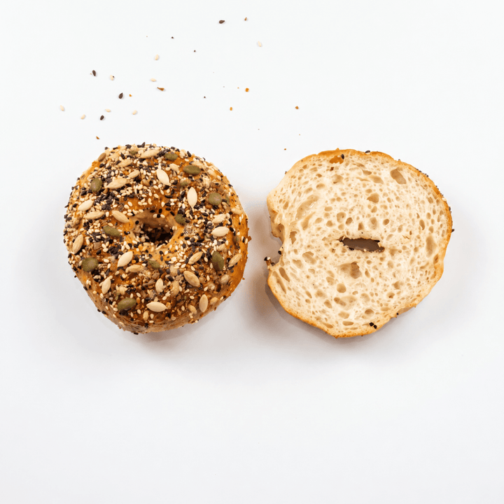 Overhead view of Gluten-Free Mixed Seed Bagels and sliced centre – SK Homemade Cakes Penang